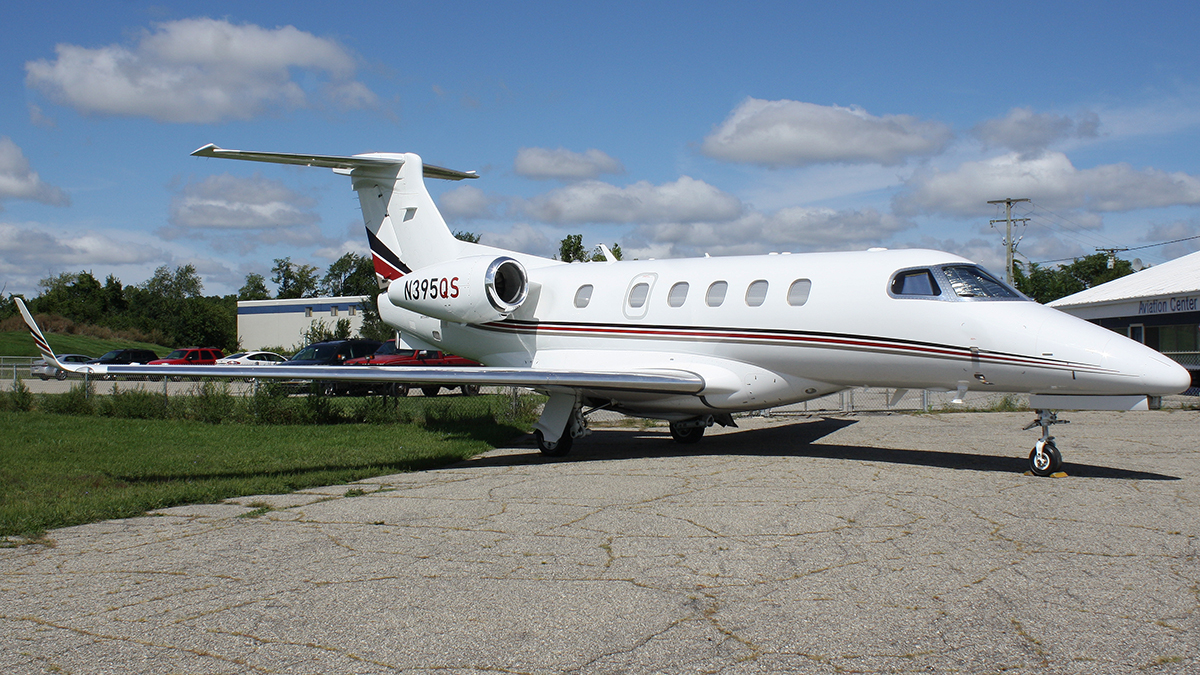 Full size: Netjets Aviation Embraer Phenom 300 N395QS at Ann Arbor Municipal Airport